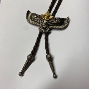 Bolo tie with golden headed egale and brown tie